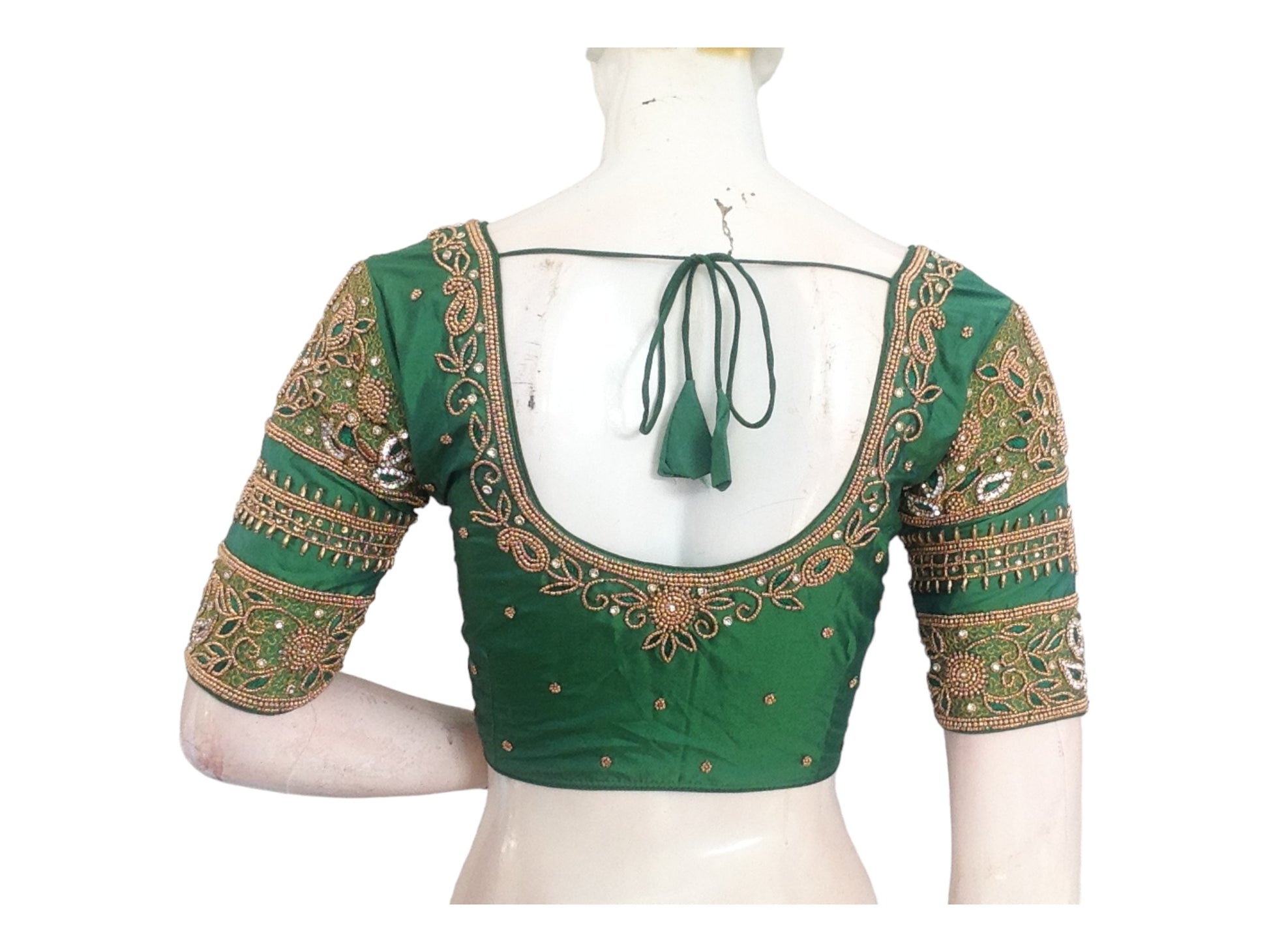 "Green Harmony: Handmade Aari Work Bridal Silk Saree Blouse, showcasing exquisite craftsmanship and luxurious design for an elegant bridal look."