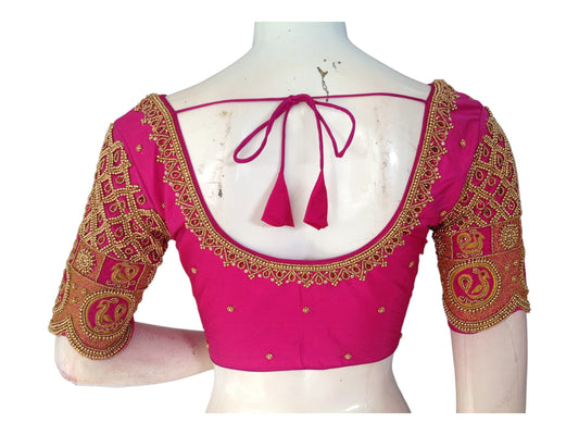"Pink Perfection: Handmade Aari Work Bridal Silk Saree Blouse, featuring exquisite craftsmanship and luxurious design for an elegant bridal look."