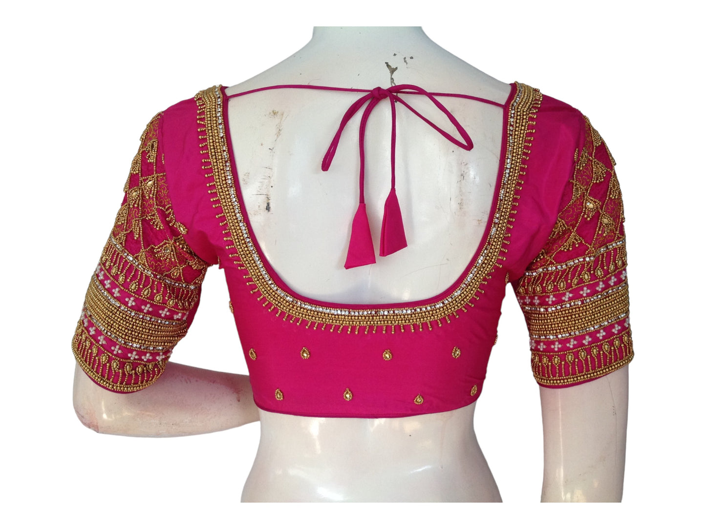 "Pink Aari Dreams: Readymade Blouses for Your Fairytale Wedding, featuring exquisite hand-embroidery and luxurious design."