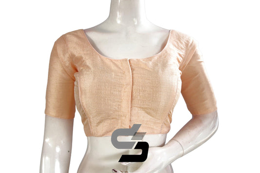 Elegant Peach: Enhance your saree ensemble with this Semi Silk Plain Readymade Saree Blouse. The soft peach hue exudes sophistication, while the simple design adds a touch of elegance to your look. Perfect for any occasion, this blouse offers timeless style and versatility.