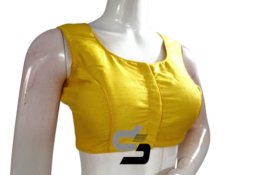 Sunshine Chic: Radiate warmth and style with this Yellow Sleeveless Plain Semi Silk Designer Indian Readymade Blouse. Its vibrant hue brings a sunny disposition to any occasion, while the sleek design adds a touch of modern sophistication.